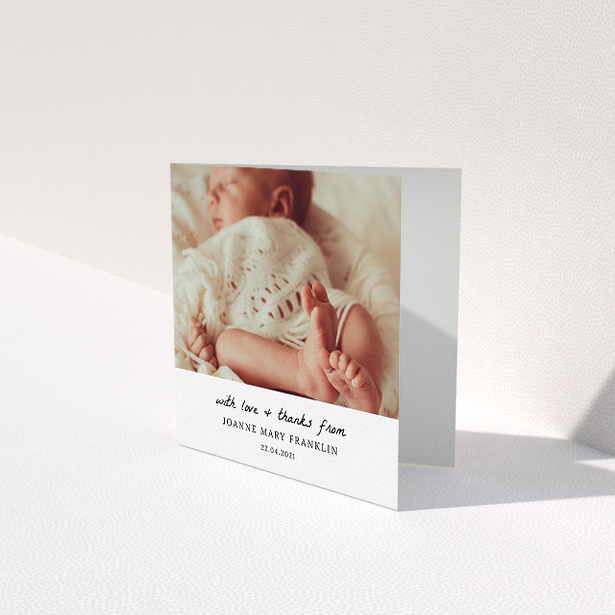A baby card design titled "Black and White Thanks". It is a square (148mm x 148mm) card in a square orientation. It is a photographic baby card with room for 1 photo. "Black and White Thanks" is available as a folded card, with mainly white colouring.