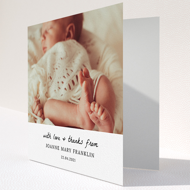 A baby card design titled "Black and White Thanks". It is a square (148mm x 148mm) card in a square orientation. It is a photographic baby card with room for 1 photo. "Black and White Thanks" is available as a folded card, with mainly white colouring.