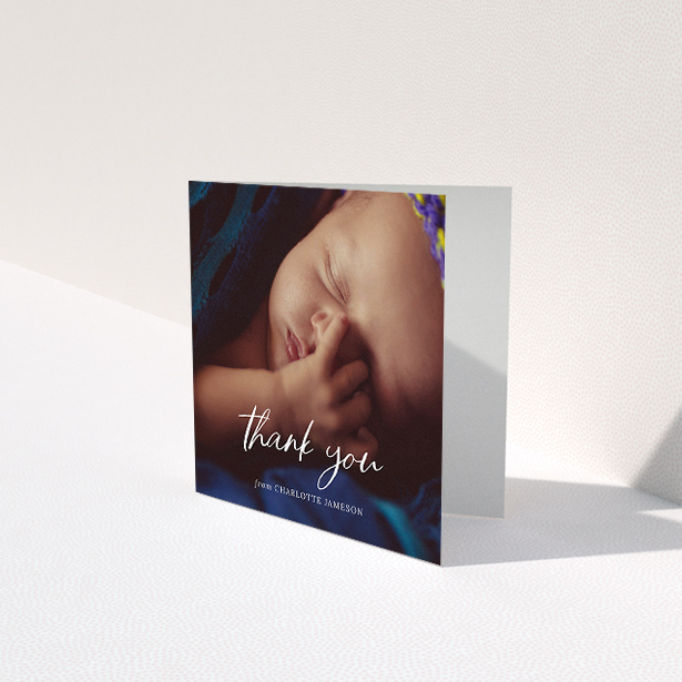 A baby card called "Calligraphy Thanks". It is a square (148mm x 148mm) card in a square orientation. It is a photographic baby card with room for 1 photo. "Calligraphy Thanks" is available as a folded card, with mainly white colouring.