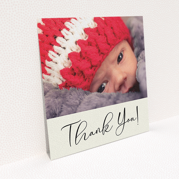 A baby card named "Cursive Thanks". It is a square (148mm x 148mm) card in a square orientation. It is a photographic baby card with room for 1 photo. "Cursive Thanks" is available as a flat card, with mainly cream colouring.