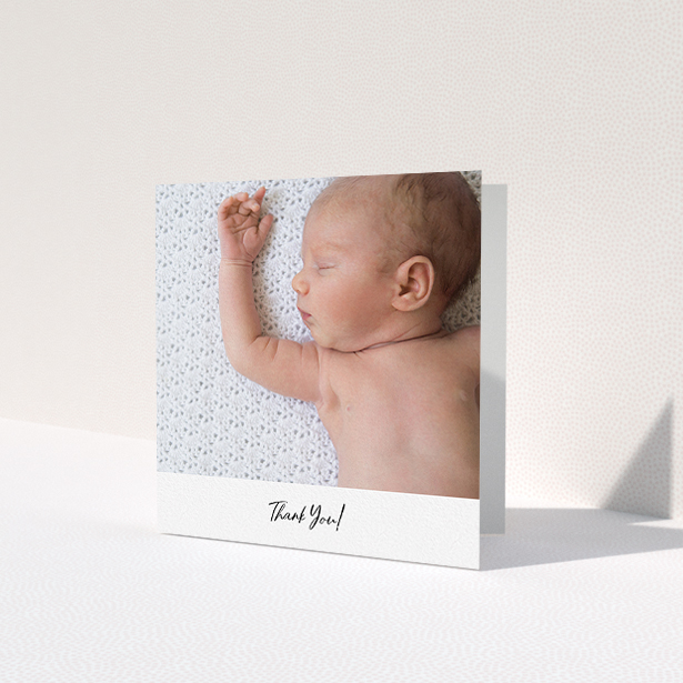A baby card called 'Mr & Mrs Footer'. It is a square (148mm x 148mm) card in a square orientation. It is a photographic baby card with room for 1 photo. 'Mr & Mrs Footer' is available as a folded card, with mainly white colouring.