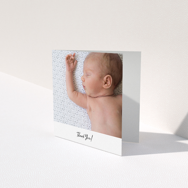 A baby card called "Mr & Mrs Footer". It is a square (148mm x 148mm) card in a square orientation. It is a photographic baby card with room for 1 photo. "Mr & Mrs Footer" is available as a folded card, with mainly white colouring.