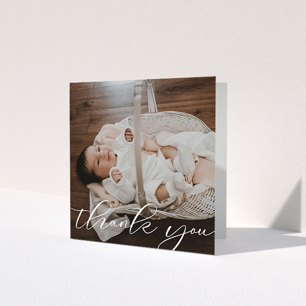 A baby card design called 'One Photo'. It is a square (148mm x 148mm) card in a square orientation. It is a photographic baby card with room for 1 photo. 'One Photo' is available as a folded card, with mainly white colouring.