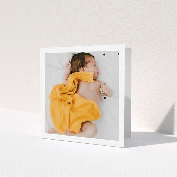 A baby card named 'One Photo Thanks'. It is a square (148mm x 148mm) card in a square orientation. It is a photographic baby card with room for 1 photo. 'One Photo Thanks' is available as a folded card, with mainly white colouring.