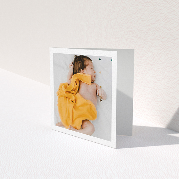 A baby card named "One Photo Thanks". It is a square (148mm x 148mm) card in a square orientation. It is a photographic baby card with room for 1 photo. "One Photo Thanks" is available as a folded card, with mainly white colouring.
