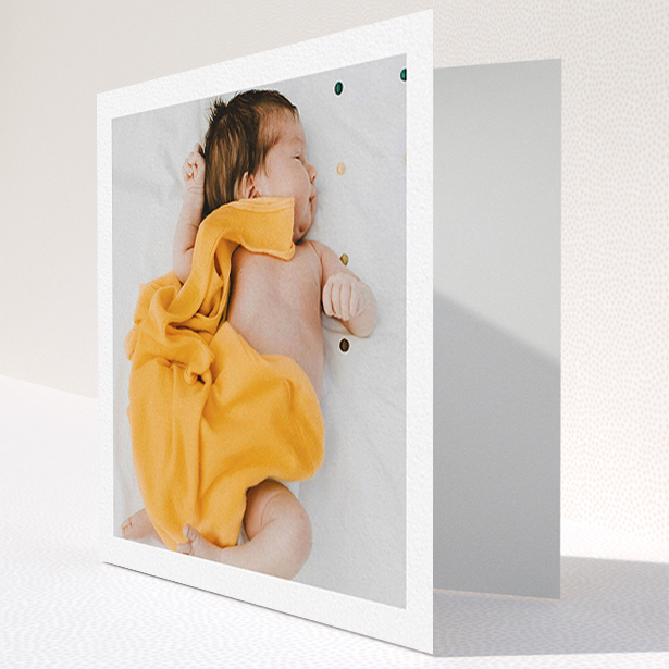 A baby card named "One Photo Thanks". It is a square (148mm x 148mm) card in a square orientation. It is a photographic baby card with room for 1 photo. "One Photo Thanks" is available as a folded card, with mainly white colouring.