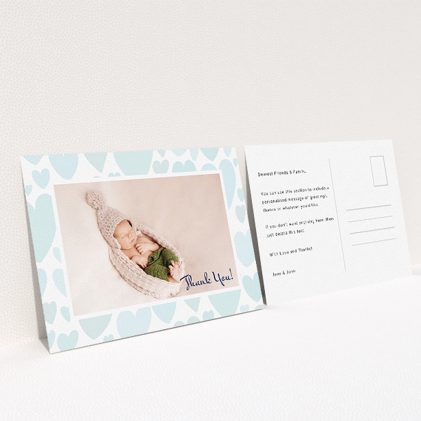 A baby card design named "Pastel Hearts". It is an A5 card in a landscape orientation. It is a photographic baby card with room for 1 photo. "Pastel Hearts" is available as a flat card, with tones of blue and white.