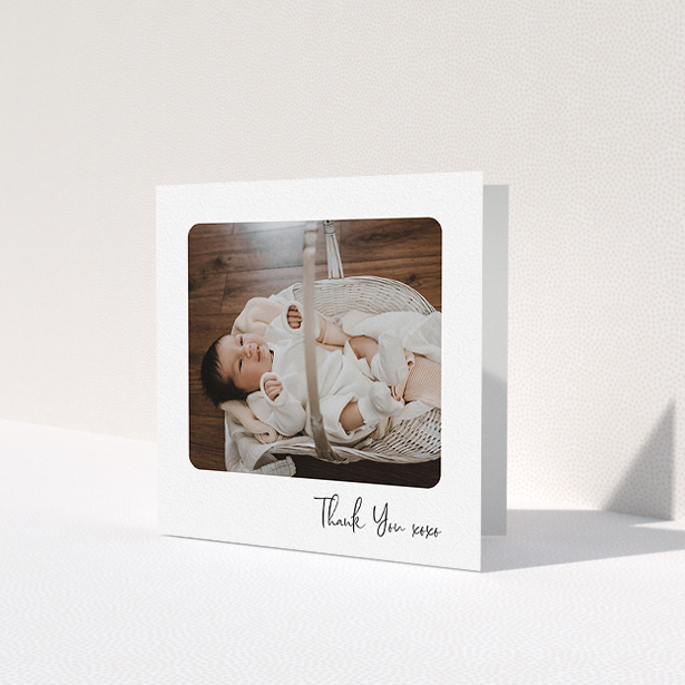 A baby card template titled 'Rounded Thanks'. It is a square (148mm x 148mm) card in a square orientation. It is a photographic baby card with room for 1 photo. 'Rounded Thanks' is available as a folded card, with mainly white colouring.