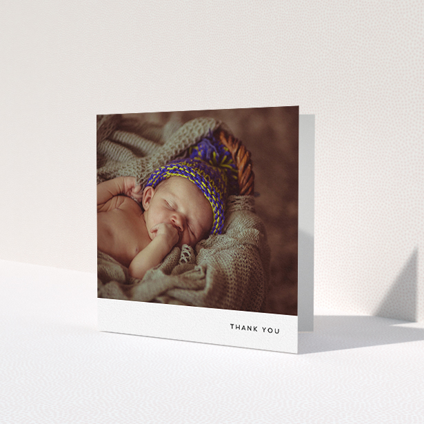 A baby card design titled 'Thankful with Simplicity'. It is a square (148mm x 148mm) card in a square orientation. It is a photographic baby card with room for 1 photo. 'Thankful with Simplicity' is available as a folded card, with mainly white colouring.