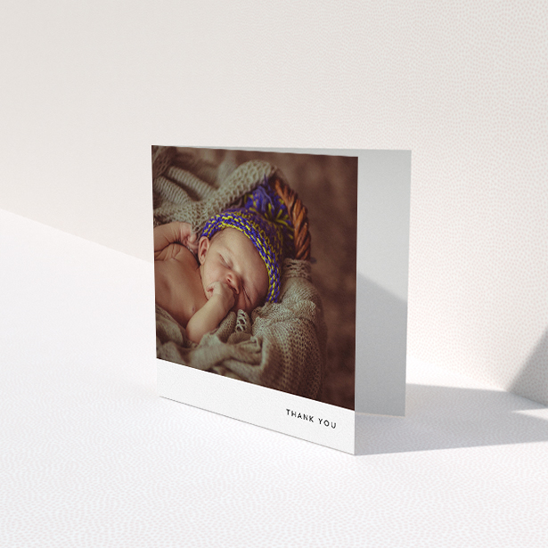 A baby card design titled "Thankful with Simplicity". It is a square (148mm x 148mm) card in a square orientation. It is a photographic baby card with room for 1 photo. "Thankful with Simplicity" is available as a folded card, with mainly white colouring.