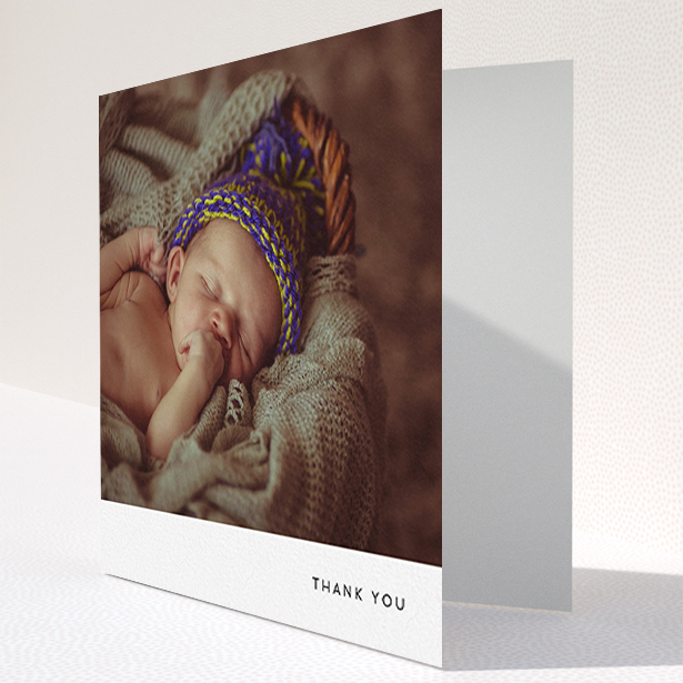 A baby card design titled "Thankful with Simplicity". It is a square (148mm x 148mm) card in a square orientation. It is a photographic baby card with room for 1 photo. "Thankful with Simplicity" is available as a folded card, with mainly white colouring.