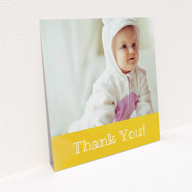 A baby card named "Thanks In Yellow". It is a square (148mm x 148mm) card in a square orientation. It is a photographic baby card with room for 1 photo. "Thanks In Yellow" is available as a flat card, with tones of yellow and white.