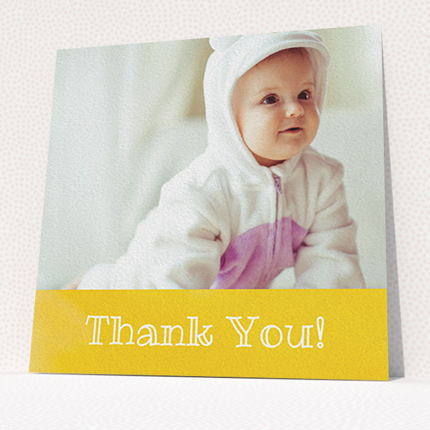 A baby card named "Thanks In Yellow". It is a square (148mm x 148mm) card in a square orientation. It is a photographic baby card with room for 1 photo. "Thanks In Yellow" is available as a flat card, with tones of yellow and white.