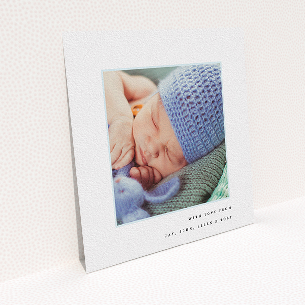 A baby card called "Thin Blue Frame". It is a square (148mm x 148mm) card in a square orientation. It is a photographic baby card with room for 1 photo. "Thin Blue Frame" is available as a flat card, with tones of white and blue.
