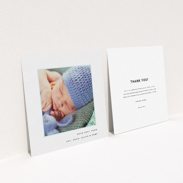 A baby card called "Thin Blue Frame". It is a square (148mm x 148mm) card in a square orientation. It is a photographic baby card with room for 1 photo. "Thin Blue Frame" is available as a flat card, with tones of white and blue.
