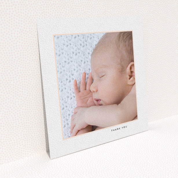 A baby card named "Thin Pink Frame". It is a square (148mm x 148mm) card in a square orientation. It is a photographic baby card with room for 1 photo. "Thin Pink Frame" is available as a flat card, with tones of white and pink.