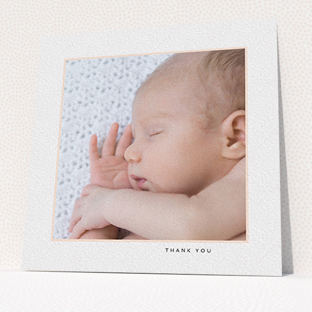 A baby card named "Thin Pink Frame". It is a square (148mm x 148mm) card in a square orientation. It is a photographic baby card with room for 1 photo. "Thin Pink Frame" is available as a flat card, with tones of white and pink.