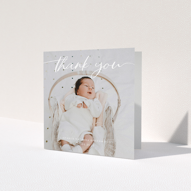 A baby card called 'Topped and Bottomed'. It is a square (148mm x 148mm) card in a square orientation. It is a photographic baby card with room for 1 photo. 'Topped and Bottomed' is available as a folded card, with mainly white colouring.