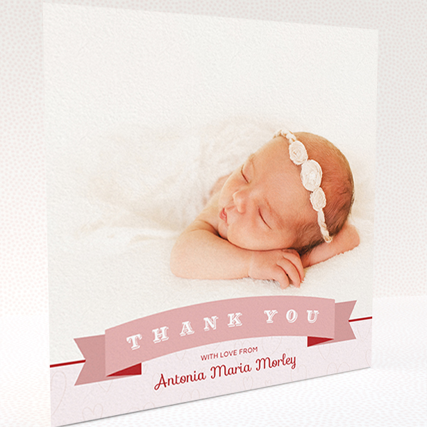 A baby thank you card named "Big Banner". It is a square (148mm x 148mm) card in a square orientation. It is a photographic baby thank you card with room for 1 photo. "Big Banner" is available as a folded card, with tones of pink and white.
