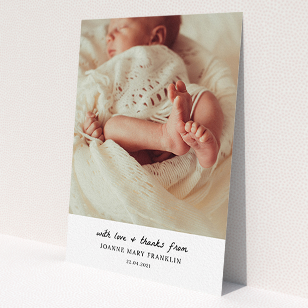 A baby thank you card design called 'Black and White Thanks'. It is an A6 card in a portrait orientation. It is a photographic baby thank you card with room for 1 photo. 'Black and White Thanks' is available as a flat card, with mainly white colouring.