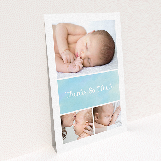 A baby thank you card template titled "Block Tower". It is an A6 card in a portrait orientation. It is a photographic baby thank you card with room for 3 photos. "Block Tower" is available as a flat card, with tones of blue and white.