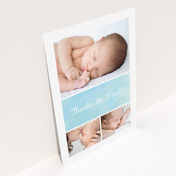 A baby thank you card template titled "Block Tower". It is an A6 card in a portrait orientation. It is a photographic baby thank you card with room for 3 photos. "Block Tower" is available as a flat card, with tones of blue and white.