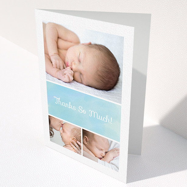 A baby thank you card template titled "Block Tower". It is an A6 card in a portrait orientation. It is a photographic baby thank you card with room for 3 photos. "Block Tower" is available as a folded card, with tones of blue and white.