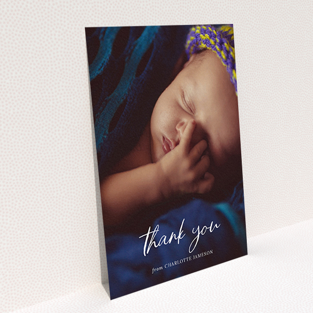 A baby thank you card template titled "Calligraphy Thanks". It is an A6 card in a portrait orientation. It is a photographic baby thank you card with room for 1 photo. "Calligraphy Thanks" is available as a flat card, with mainly white colouring.