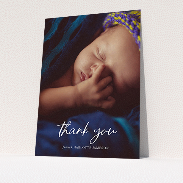 A baby thank you card template titled "Calligraphy Thanks". It is an A6 card in a portrait orientation. It is a photographic baby thank you card with room for 1 photo. "Calligraphy Thanks" is available as a flat card, with mainly white colouring.
