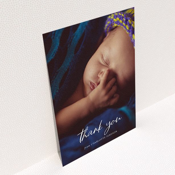 A baby thank you card template titled "Calligraphy Thanks". It is an A6 card in a portrait orientation. It is a photographic baby thank you card with room for 1 photo. "Calligraphy Thanks" is available as a flat card, with mainly white colouring.