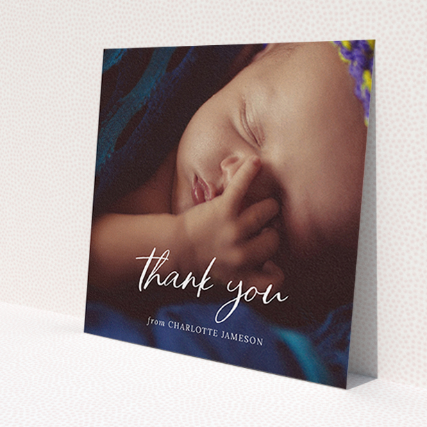 A baby thank you card design titled 'Calligraphy Thanks'. It is a square (148mm x 148mm) card in a square orientation. It is a photographic baby thank you card with room for 1 photo. 'Calligraphy Thanks' is available as a flat card, with mainly white colouring.