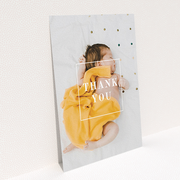 A baby thank you card design called "Central Thanks". It is an A6 card in a portrait orientation. It is a photographic baby thank you card with room for 1 photo. "Central Thanks" is available as a flat card, with mainly white colouring.