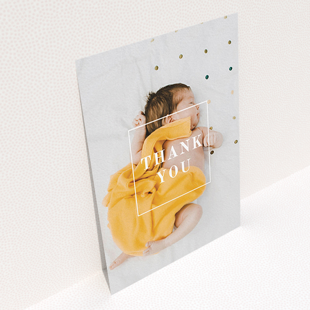 A baby thank you card design called "Central Thanks". It is an A6 card in a portrait orientation. It is a photographic baby thank you card with room for 1 photo. "Central Thanks" is available as a flat card, with mainly white colouring.