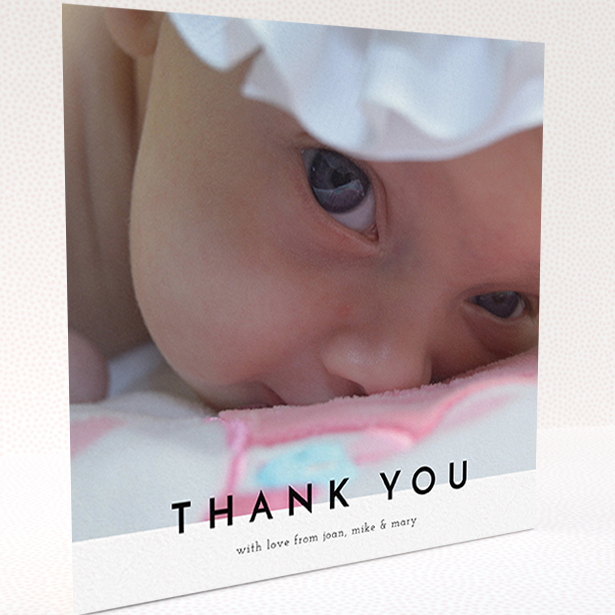 A baby thank you card design titled "Cross Border". It is a square (148mm x 148mm) card in a square orientation. It is a photographic baby thank you card with room for 1 photo. "Cross Border" is available as a folded card, with mainly white colouring.