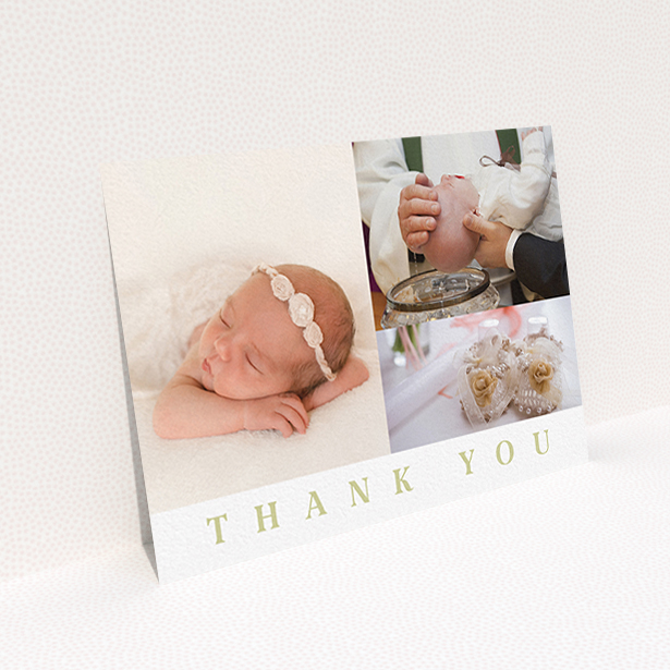A baby thank you card named "One and Two Half Frames". It is an A6 card in a landscape orientation. It is a photographic baby thank you card with room for 3 photos. "One and Two Half Frames" is available as a flat card, with tones of white and gold.