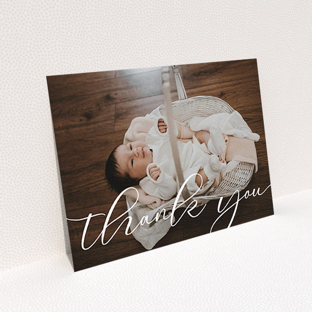 A baby thank you card design titled "One Photo". It is an A6 card in a landscape orientation. It is a photographic baby thank you card with room for 1 photo. "One Photo" is available as a flat card, with mainly white colouring.