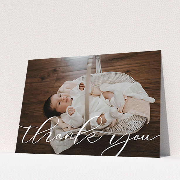 A baby thank you card design titled "One Photo". It is an A6 card in a landscape orientation. It is a photographic baby thank you card with room for 1 photo. "One Photo" is available as a flat card, with mainly white colouring.