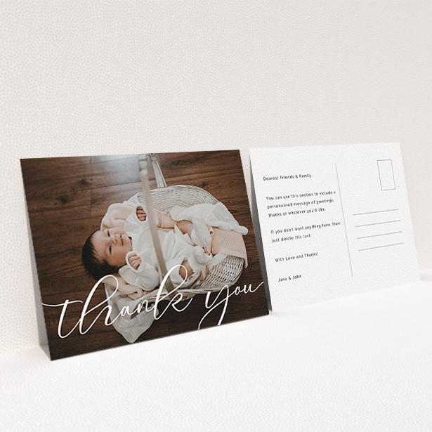 A baby thank you card design titled "One Photo". It is an A6 card in a landscape orientation. It is a photographic baby thank you card with room for 1 photo. "One Photo" is available as a flat card, with mainly white colouring.