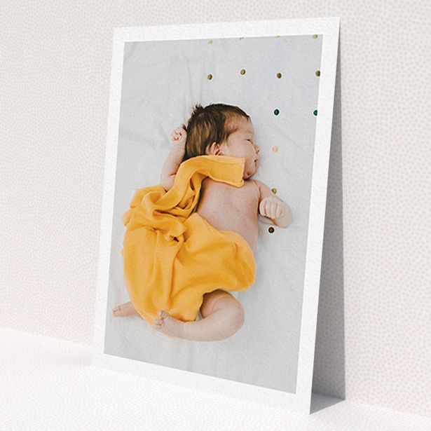 A baby thank you card design titled 'One Photo Thanks'. It is an A6 card in a portrait orientation. It is a photographic baby thank you card with room for 1 photo. 'One Photo Thanks' is available as a flat card, with mainly white colouring.