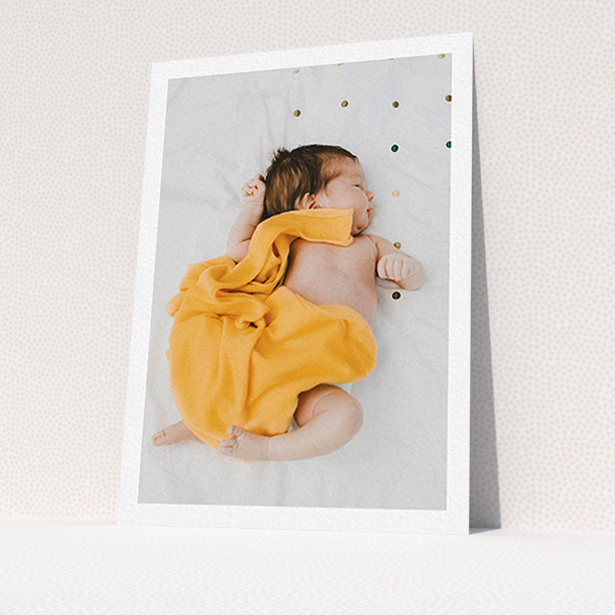 A baby thank you card design titled "One Photo Thanks". It is an A6 card in a portrait orientation. It is a photographic baby thank you card with room for 1 photo. "One Photo Thanks" is available as a flat card, with mainly white colouring.