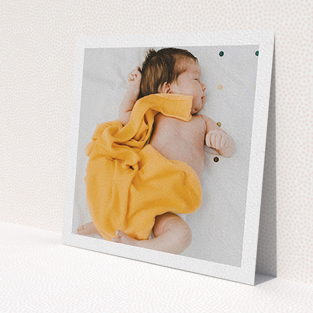 A baby thank you card design called 'One Photo Thanks'. It is a square (148mm x 148mm) card in a square orientation. It is a photographic baby thank you card with room for 1 photo. 'One Photo Thanks' is available as a flat card, with mainly white colouring.