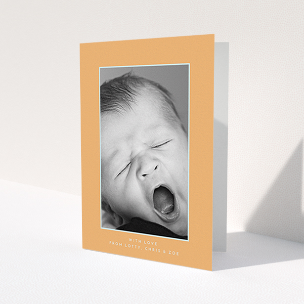 A baby thank you card design named 'Orange and Mint'. It is an A6 card in a portrait orientation. It is a photographic baby thank you card with room for 1 photo. 'Orange and Mint' is available as a folded card, with tones of orange and blue.