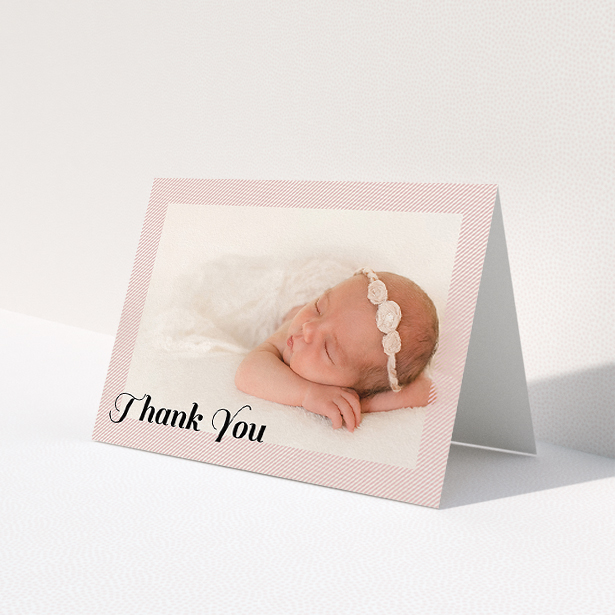 A baby thank you card design called 'Pastel Diagonals'. It is an A5 card in a landscape orientation. It is a photographic baby thank you card with room for 1 photo. 'Pastel Diagonals' is available as a folded card, with tones of pink and white.