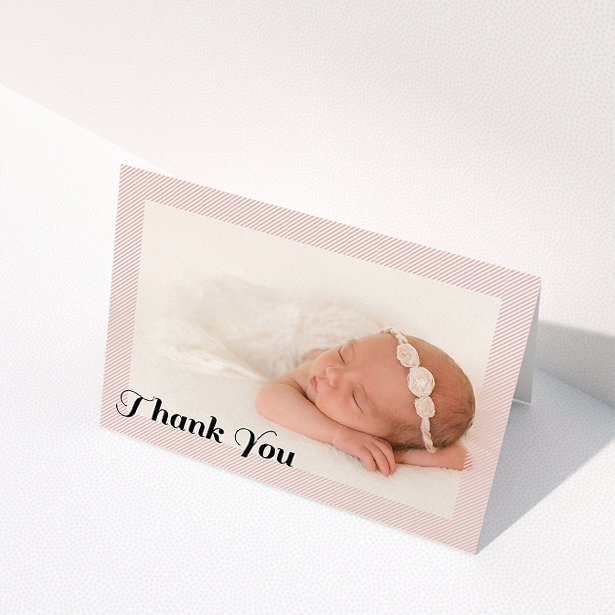 A baby thank you card design called "Pastel Diagonals". It is an A5 card in a landscape orientation. It is a photographic baby thank you card with room for 1 photo. "Pastel Diagonals" is available as a folded card, with tones of pink and white.
