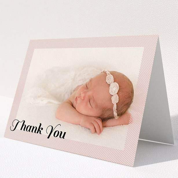 A baby thank you card design called "Pastel Diagonals". It is an A5 card in a landscape orientation. It is a photographic baby thank you card with room for 1 photo. "Pastel Diagonals" is available as a folded card, with tones of pink and white.
