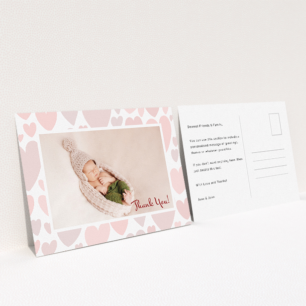 A baby thank you card design called "Pastel Hearts". It is an A5 card in a landscape orientation. It is a photographic baby thank you card with room for 1 photo. "Pastel Hearts" is available as a flat card, with tones of pink and white.