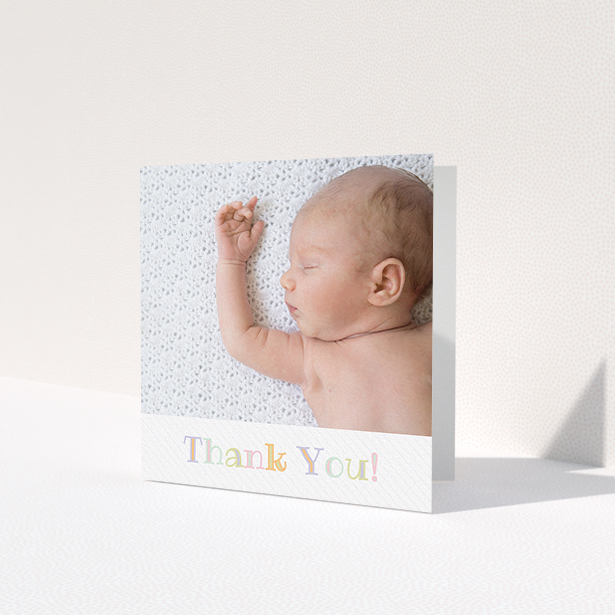 A baby thank you card design named 'Pastel Thank You'. It is a square (148mm x 148mm) card in a square orientation. It is a photographic baby thank you card with room for 1 photo. 'Pastel Thank You' is available as a folded card, with tones of white and green.