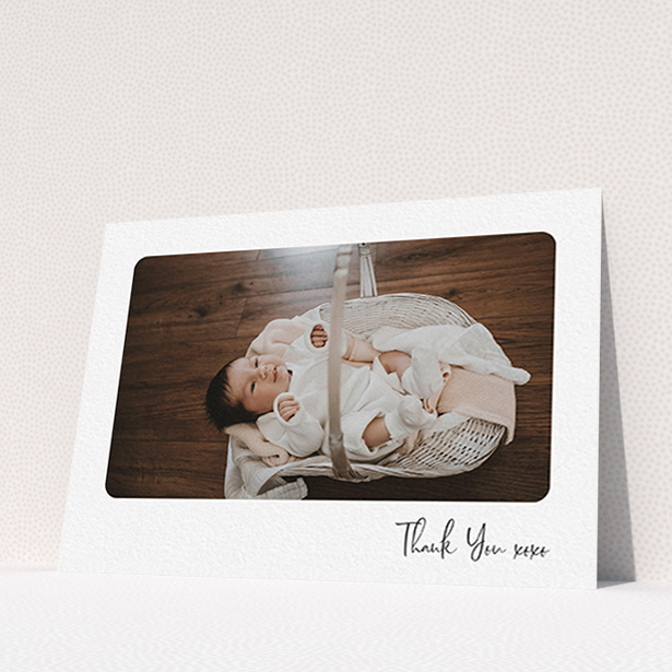 A baby thank you card design named "Rounded Thanks". It is an A6 card in a landscape orientation. It is a photographic baby thank you card with room for 1 photo. "Rounded Thanks" is available as a flat card, with mainly white colouring.