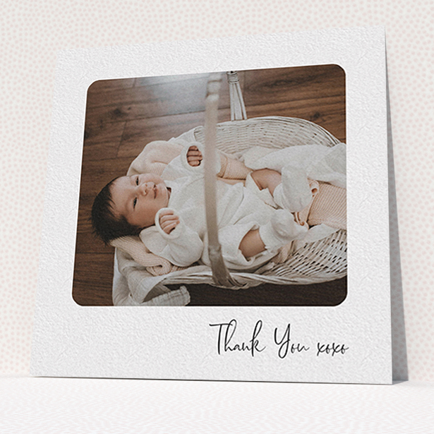 A baby thank you card named "Rounded Thanks". It is a square (148mm x 148mm) card in a square orientation. It is a photographic baby thank you card with room for 1 photo. "Rounded Thanks" is available as a flat card, with mainly white colouring.