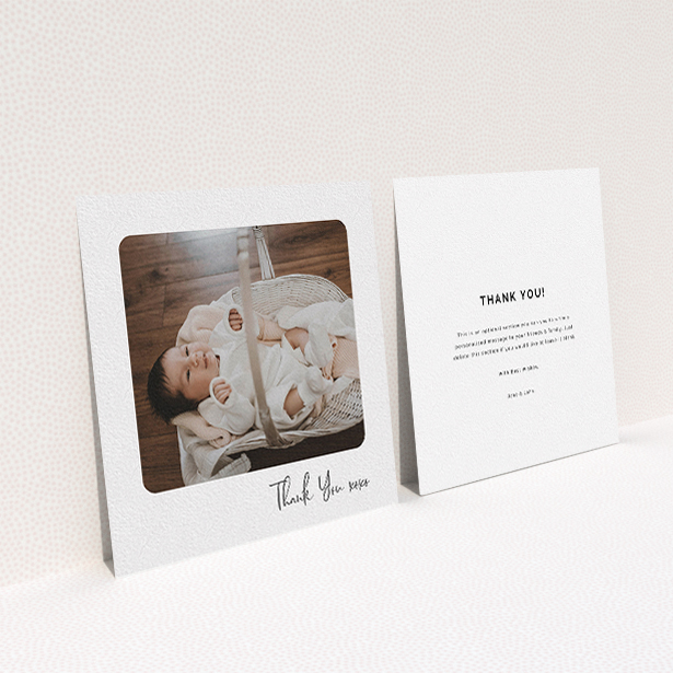 A baby thank you card named "Rounded Thanks". It is a square (148mm x 148mm) card in a square orientation. It is a photographic baby thank you card with room for 1 photo. "Rounded Thanks" is available as a flat card, with mainly white colouring.